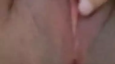 Indian slut rubs wet pussy